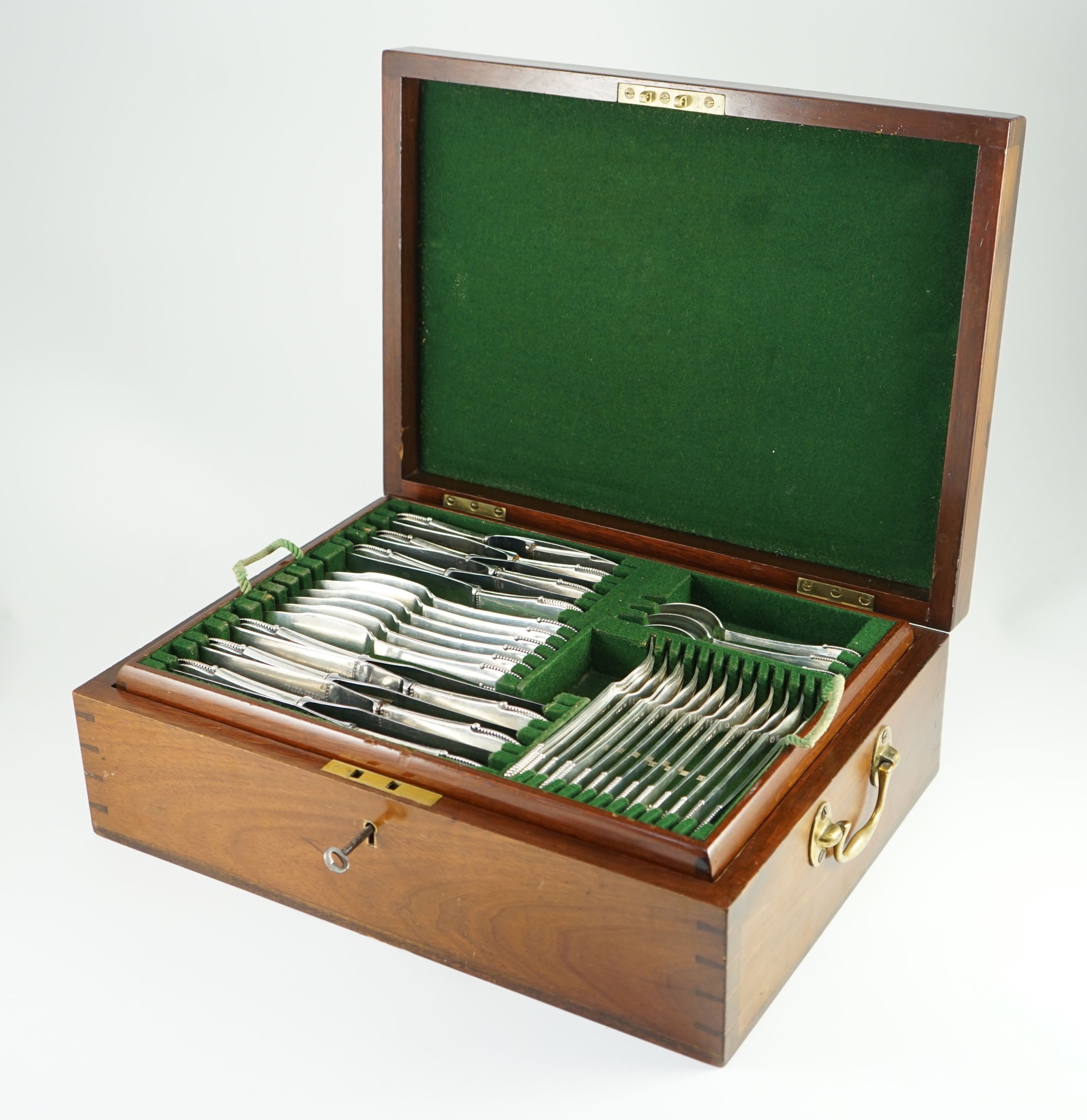 An early 20th century Georg Jensen canteen of beaded pattern silver cutlery